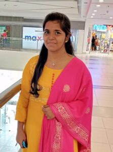Image of Janani Priya standing in a shopping centre